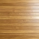 Glatt hobelfräste Holzdiele aus Iroko (Kambala) mit feiner Maserung in warmem Goldbraun